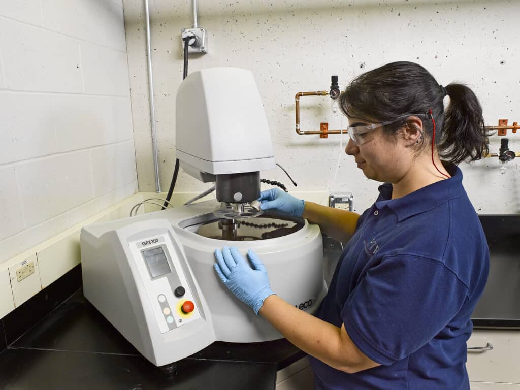 Welding Engineer Polishing Weld Sample in Metlab